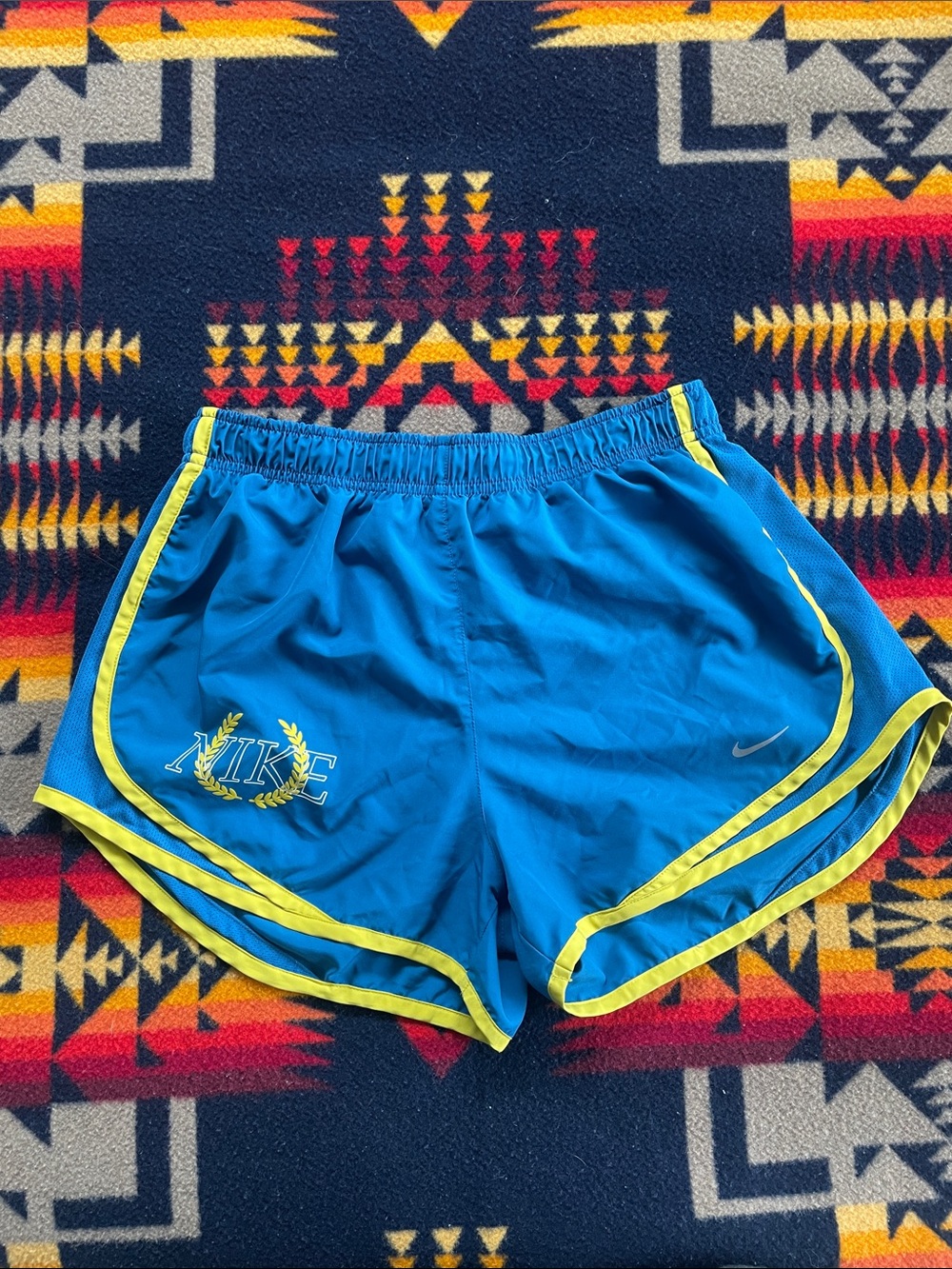 Nike Women's Blue Athletic Shorts with Yellow Trim